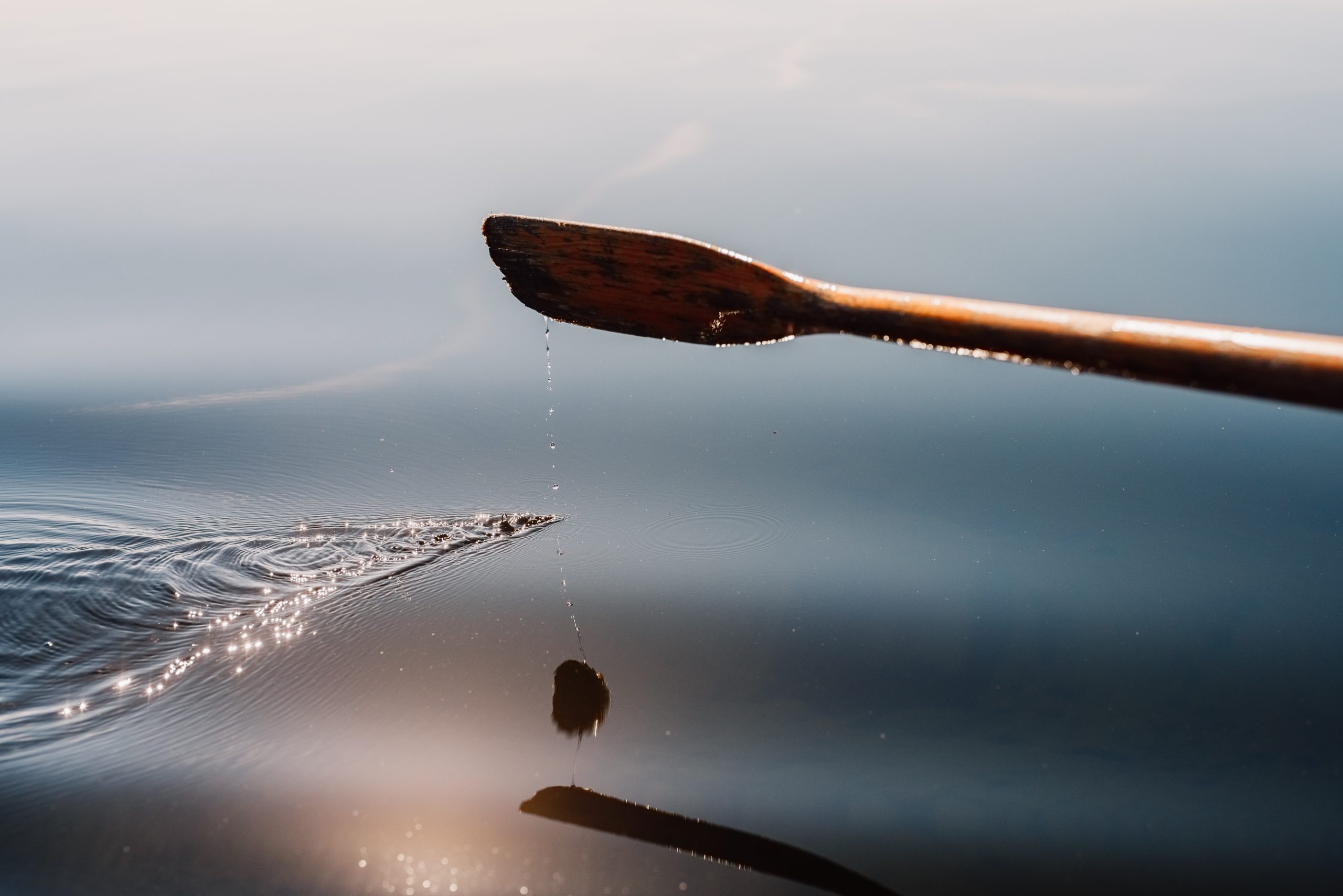 Oar rowing boat close up on a clear lake